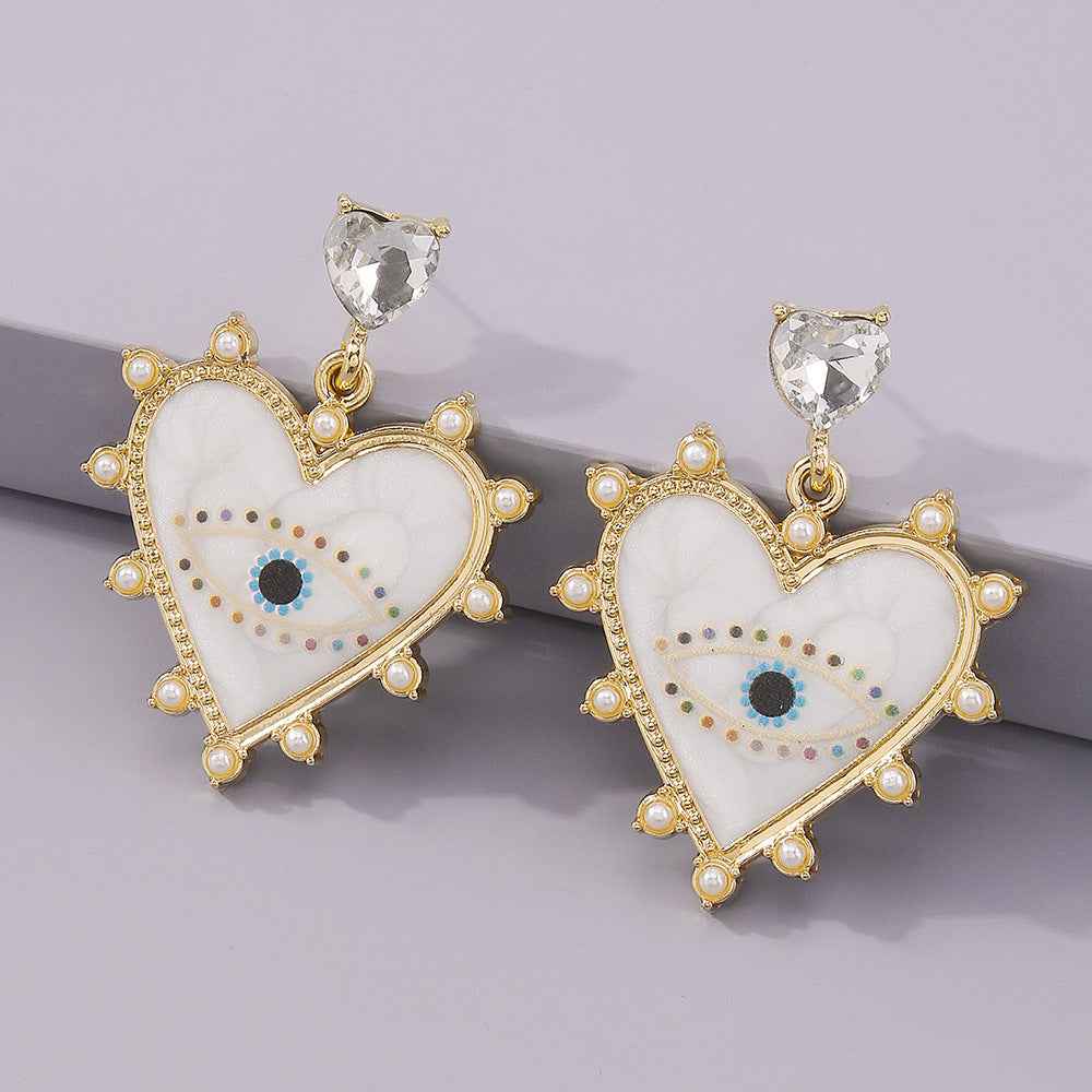 Exaggerated heart-shaped devil's eye earrings