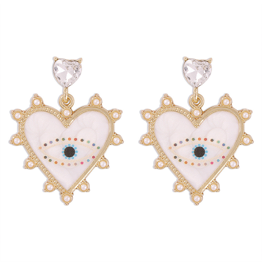 Exaggerated heart-shaped devil's eye earrings