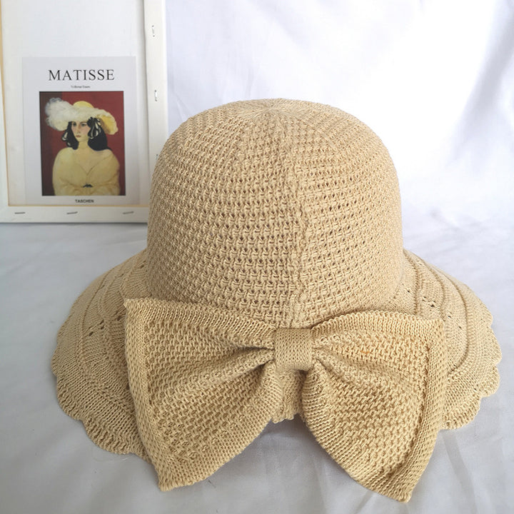 Foldable knitted straw hat with bow