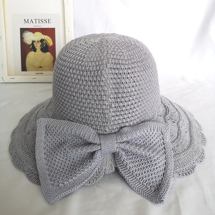 Foldable knitted straw hat with bow