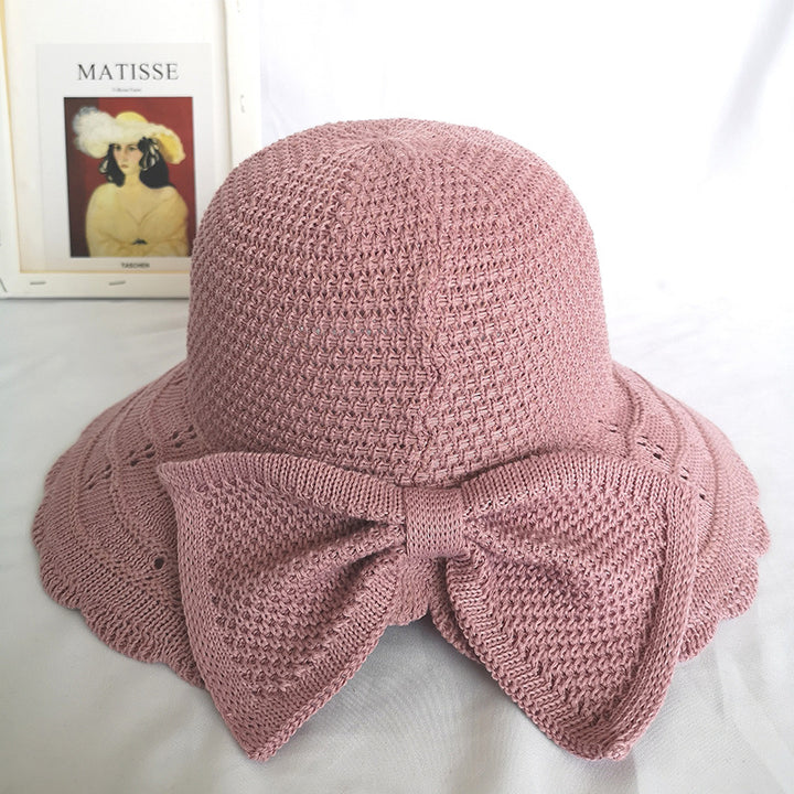 Foldable knitted straw hat with bow