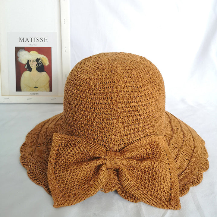 Foldable knitted straw hat with bow