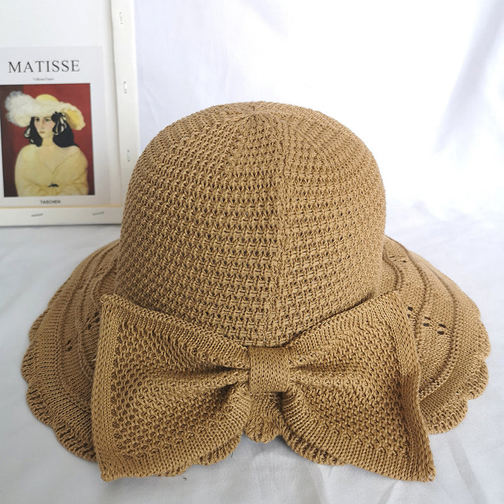 Foldable knitted straw hat with bow