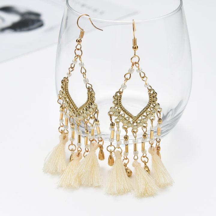 Bohemian hollow dripping oil rice beads fan-shaped tassel long earrings