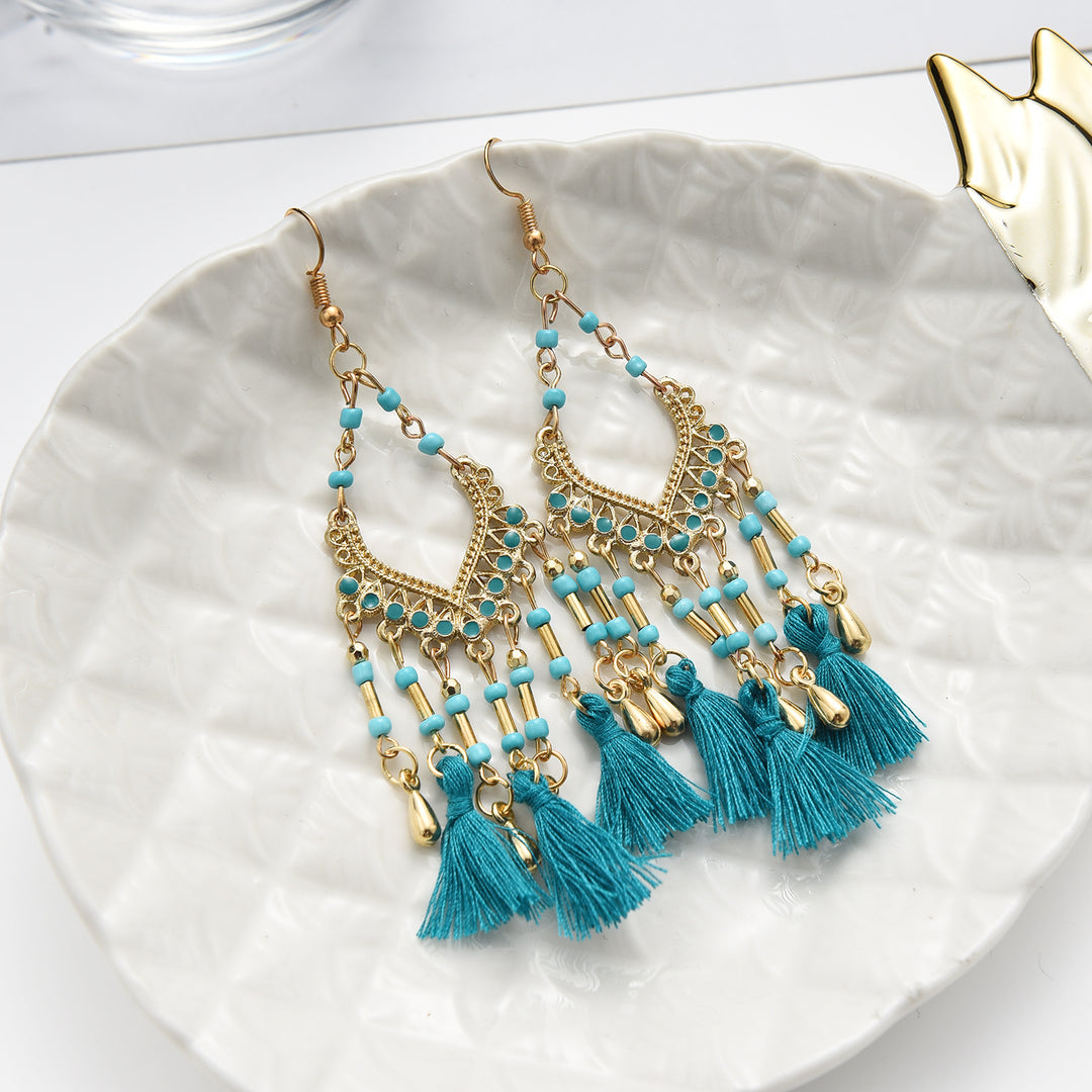 Bohemian hollow dripping oil rice beads fan-shaped tassel long earrings